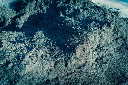 Compost close-up, textured fertile soil as background. Organic gardening season cultivated dirt,...