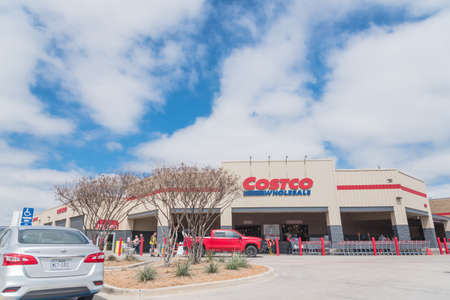 TEXAS, USA-MARCH 21, 2020: Busy customers walking in and exit the Costco Wholesale store in...