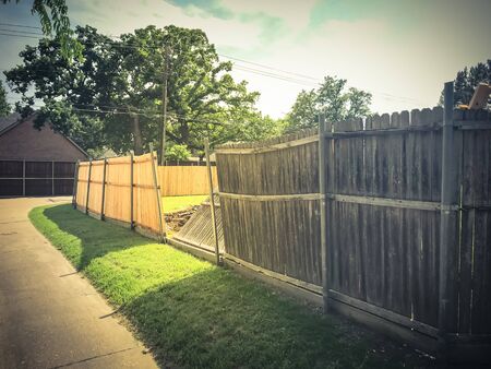 Large backyard of corner house with wooden fence replacement in progress suburbs Dallas, Texas, USAの写真素材