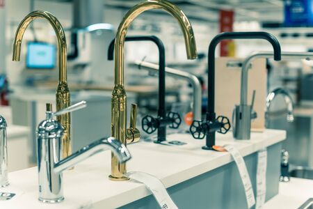 Wide selection of shiny bath faucet in chrome plated at kitchen showroom near Dallas, Texas, USAの写真素材