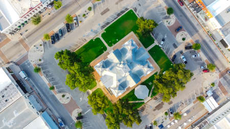 90 degree aerial view of Historic Hood County Courthouse in Downtown Square Granbury, Texas, USA....