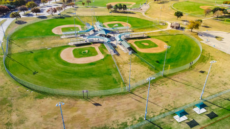 Top view four baseball/softball field with natural grass fields, ticket offices, batting cages, pavilion, spectator seating near Dallas, Texas. Large sport facility venue for practice, tournamentsの写真素材