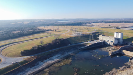 Texas side of Denison Dam with hydroelectric turbine powerhouse. Aerial view rock-protected upstream slope, earth-filled embankment Lake Texoma Dam on Red River between Texas and Oklahomaのeditorial素材