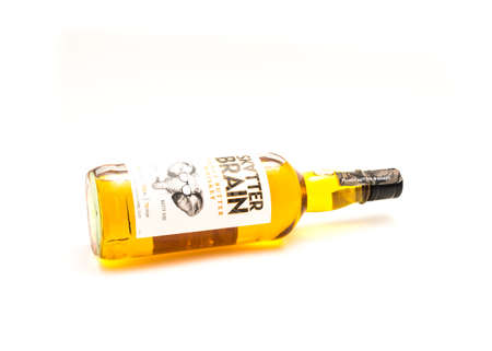 DALLAS, TX, USA-APR 27, 2022: Horizontal side view of Skatterbrain Peanut Butter Whiskey bottle...