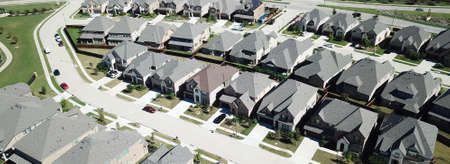 Panorama aerial view new upscale residential neighborhood with row of two story houses in North...