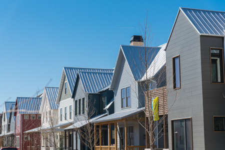 New development townhome with metal roof and covered gutters near Oklahoma City, US. Colorful urban...