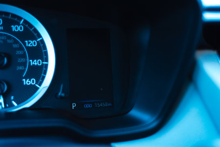 Illuminated odometer on dashboard warning area near speedometer when car in parking mode of new...