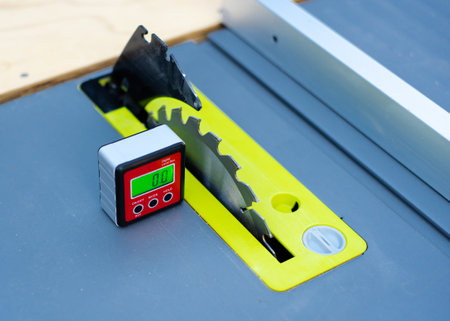 Digital level box inclinometer showing level 0-degree angle with magnetic base attaches to metal...