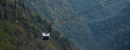 Lush green valleys and towering mountains of Hoang Lien Son Range and Muong Hoa Valley with cable...