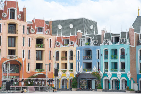 Row of colorful shophouses painted upscale townhome duplex with decorated balcony flower decoration, upscale row of multistory houses for retail, boutique, tourist attraction in Vietnam. Travelの写真素材