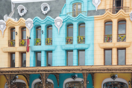 Close-up colorful shophouses painted upscale townhome duplex with decorated balcony flower decoration, upscale row of multistory houses for retail, boutique, tourist attraction in Vietnam. Travelの写真素材