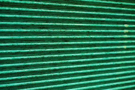 Close-up tongue and groove profile on Oriented Strand Board OSB plywood subfloors engineered to fit together quickly, added strength, hardware store in Dallas, stack sheet material particle board. USAの写真素材