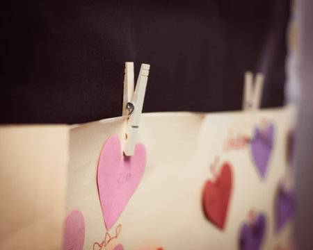 Toned photo cute heart shape paper crafts rope hanging attached clip classroom wall for Valentine...