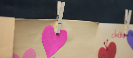 Panorama cute heart shape paper crafts rope hanging attached clip classroom wall for Valentine Day...