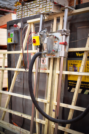 Toned photo industrial grade vertical panel saw at hardware home improvement store, Dallas, Texas, plywood cutting machine with integrated dust collection vacuum, roller bearing, safety shutdown. USAの写真素材