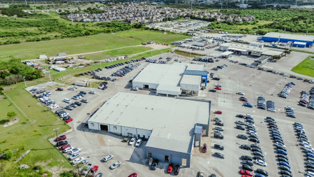 Residential neighborhood near industrial manufacturer and car dealership along Interstate highway I-35 in New Braunfels, fast growing mixed-use development area suburbs San Antonio, Texas, aerial. USA