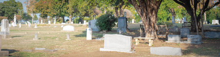 Panorama view tree shaded cemetery, burial ground, gravesite, graveyard with gravestone tombstone...