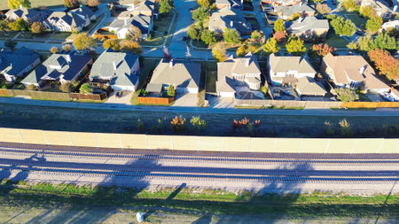 Close-up top view sound walls made of precast concrete UV coating reflective noise barriers residential neighborhood, light railroad Belt Line Road in Coppell, TX, absorptive acoustic quiet zones. USAの写真素材