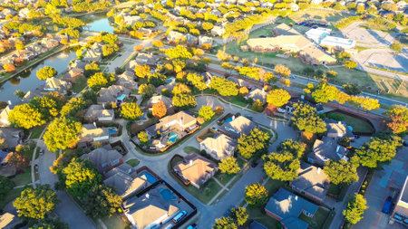 Waterfront residential area elementary school in Coppell, suburbs Dallas, Texas, colorful fall foliage autumn leaves, cluster of new development two-story house with swimming pool, large backyard. USAの写真素材