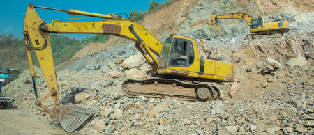 Panorama view heavy duty excavator working at highway construction project in mountainous region...