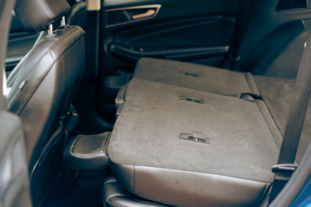 Second row seats folded on modern crossover SUV, flat folding back seats for cargo space flexibility, foldable second row chairs on modern car, seats folded completely, stow and go. USAの写真素材