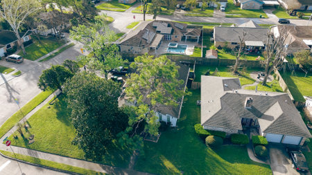 Corner houses with swimming pool, solar panel roofing, grassy lawn in Fairbanks Northwest Crossing...
