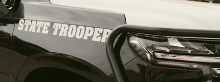 Panorama view black SUV State Trooper patrol vehicle with push bumper steel frames mounted used to...