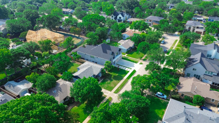 Wooden timber framing mansion houses new construction in affluent neighborhood near Walnut Hill in Dallas, wealth and allure area of luxury homes premium living experience, lush green tree, Texas. USAの写真素材