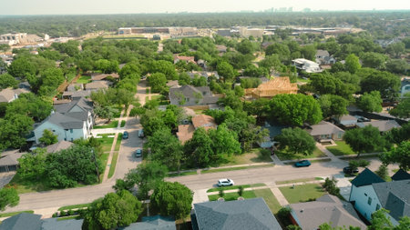 Midtown Dallas skylines from lush greenery affluent neighborhood luxurious homes, amenities, pools, two-story wooden timber framing mansion houses new construction in Walnut Hill, Texas. USの写真素材