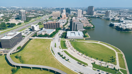 John W. Carpenter Freeway and curved elevated railway, modern cityscape of Las Colinas downtown major urban center in Irving, Texas, high-rise glass office buildings, apartment homes golf courses. USAの写真素材