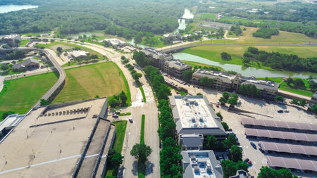 Elevated light rail, multilevel parking garage, office space for rent, riverside leasing corporate campus with covered parking in Las Colinas, Irving, suburbs Dallas Fort Worth commercial building. USの写真素材