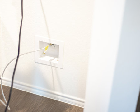 Modern wall crimp compression ice maker outlet box to install a copper water line for fridge, heavy-duty brass body resistant to corrosion, leakage. Close-up of detailed appliance plumbing work. USAの写真素材