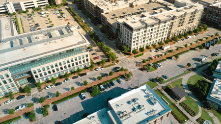 Tree lined street busy parked cars in mixed-use development Cypress Waters, Dallas, corporate office buildings, commercial zones, sustainable land use modern infrastructure in dense metropolitan. USAの写真素材