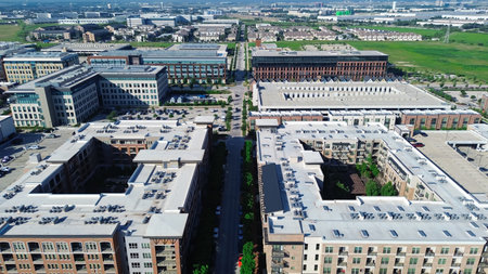 Modern apartment complex central courtyard and flat roof commercial HVAC units packages, surrounded by multilevel parking garages, office building, commercial property in Cypress Waters, Dallas. USAの写真素材