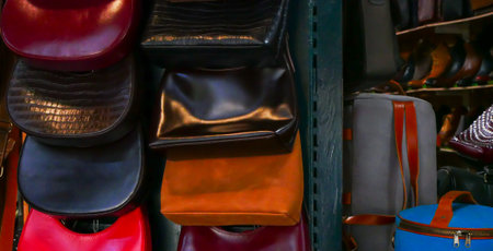 Panorama view upscale handmade leather backpack, shoes, boots, satchels line this Hoi An, Da Nang market stall. Blends tradition and fashion, offering tactile glimpse into local craftsmanship. Vietnamの写真素材