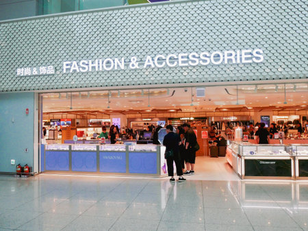INCHEON, SEOUL-AUG 4, 2025: Luxury fashion zone at Incheon Airport featuring Swarovski and Coach counters. Bright lighting, bilingual signage, and sleek design, premium shopping global travelers. KRの写真素材