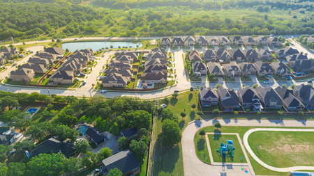 School playground, track field near new construction neighborhood in Lantana, Texas, landscaped pond...