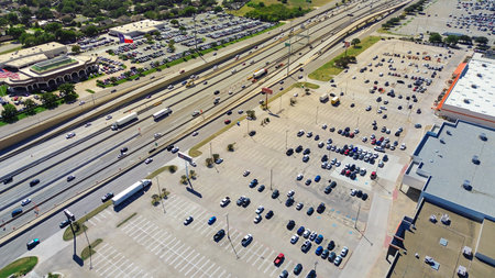 NE Loop 820 in North Richland Hills, Texas, showing multilane highway, large retail buildings with...