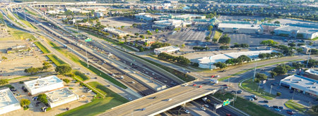 Panorama aerial view stacked interchange viaduct highway in Lewisville, Texas featuring exit ramps,...