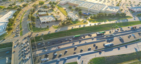 Panorama aerial view urban sprawl mixed-use development in Lewisville, Texas with peak hour traffic...
