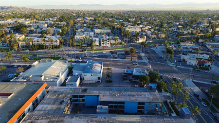 Dense urban intersection over Redondo Ave and surrounding cross streets frame flat roofed buildings...