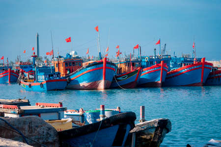 Many small boats in the harbor.Boats moored in the small harbor.Bright sea water.のeditorial素材