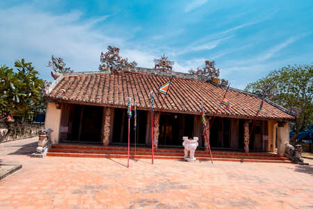 Ancient temple at Ly Son, with tiled roof and mossy wallsのeditorial素材