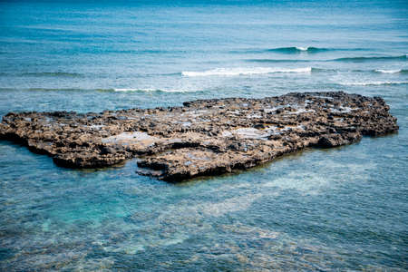 rock rising in the middle of the sea at Ly Son Island, Vietnam