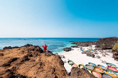 Tourists enjoying a sunny day at Playa de Armas beach.の写真素材