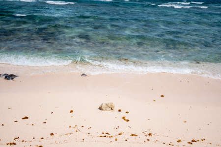 Beautiful tropical beach with white sand, turquoise water and rocks