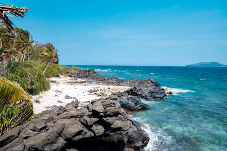 Tropical beach with white sand and turquoise water.