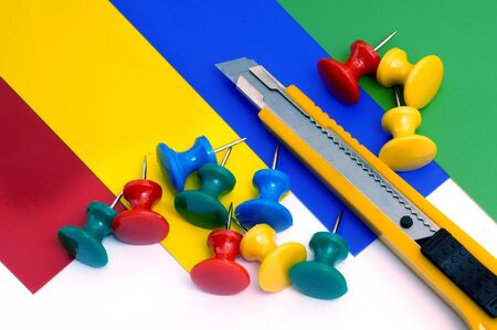 Knife for a paper on sheets of a color paper  with buttons