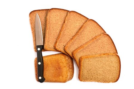 Cut bread with a knife on a white background