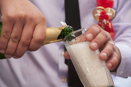 Hands pour wedding champagneの写真素材